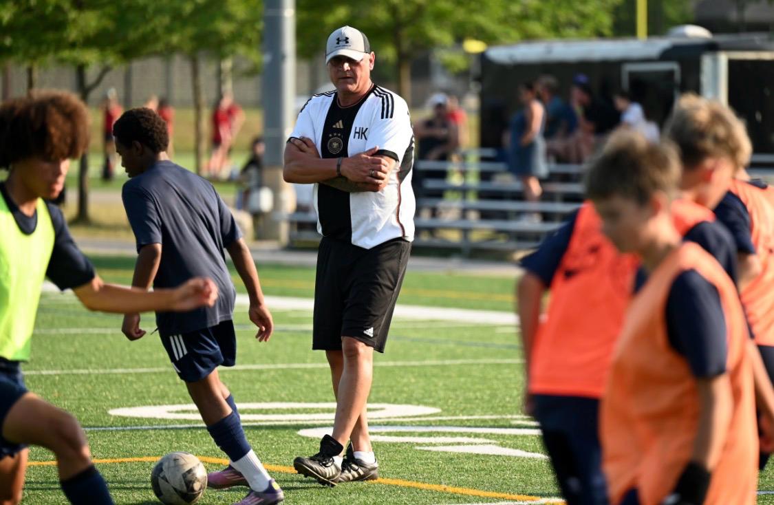 Coach observing live competitive play